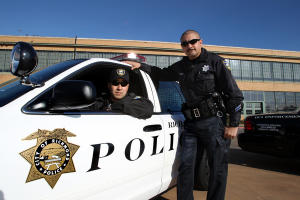 Richmond police traffic officers Ben Mendler, left, and Phil Sanchez are photographed in one of their DUI Enforcement police vehicles in Richmond, Calif.,